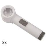 White, round lens stand magnifier with cylindrical handle grey on/off switch and grey battery port. 8x.