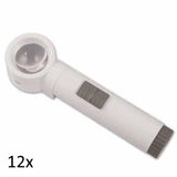 White, round lens stand magnifier with cylindrical handle grey on/off switch and grey battery port. 12x.